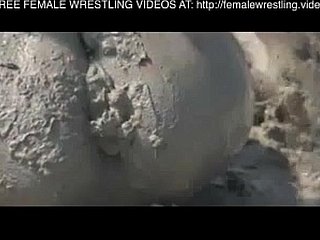 Girls wrestling regarding burnish apply mud