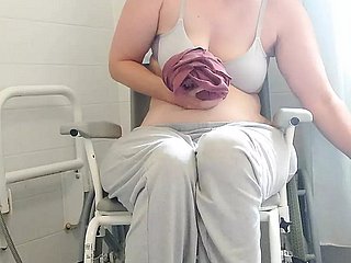 Paraplegic brunette Purplewheelz British milf peeing not far from the shower